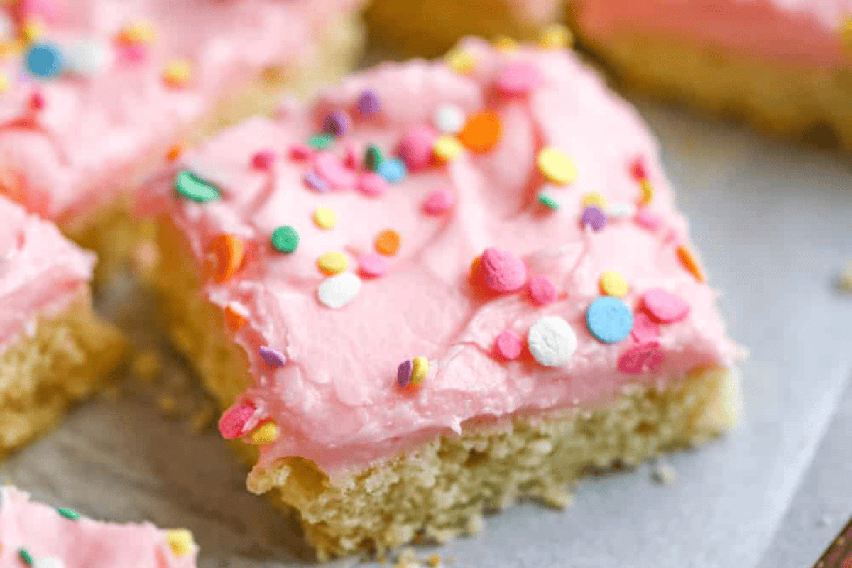 Pink frosted sugar cookie bars.