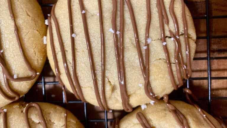 Crumbl Hazelnut Sea Salt Cookies placed on wire mesh