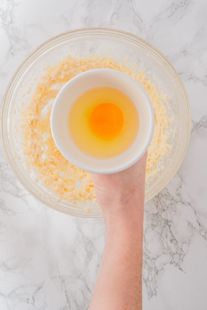 Add the egg to butter and sugar bowl