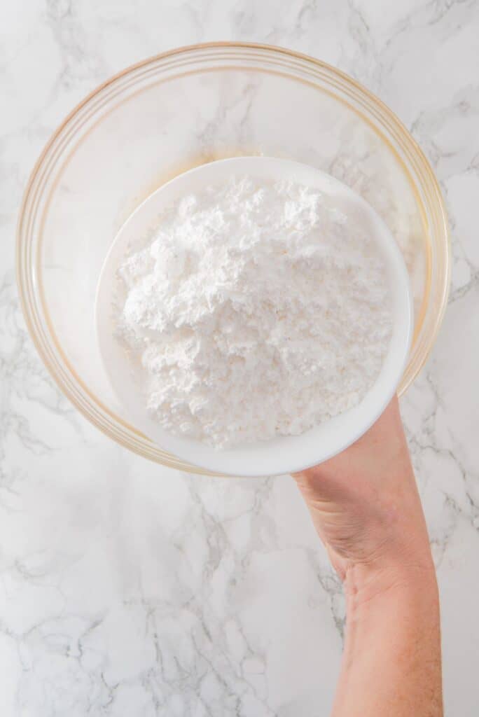 Add powdered sugar in a bowl