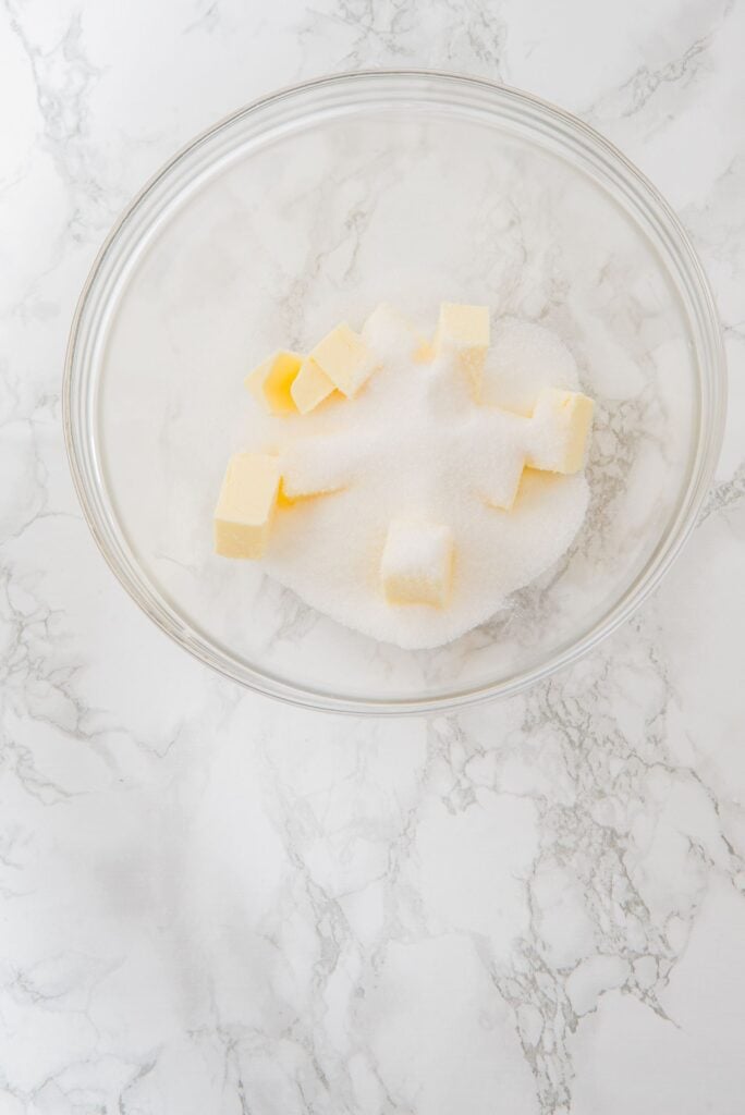 Butter cubes and sugar in a large bowl