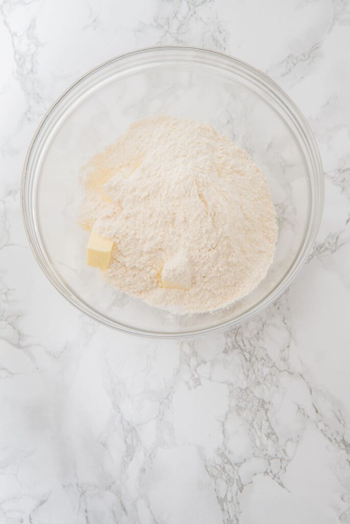 Butter cubes, sugar and flour in a large bowl