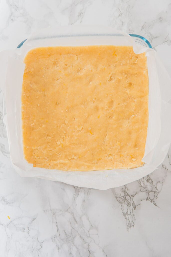 Line a 9x9-inch baking pan with parchment paper for easy removal. 