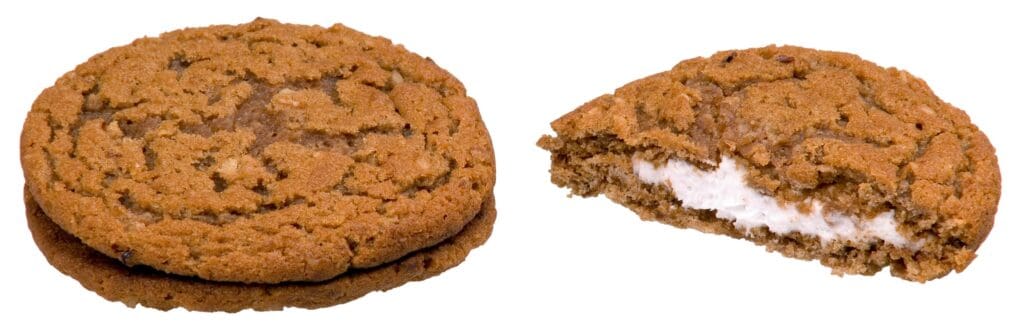 Two Little Debbie Oatmeal Creme Pies on a white background, one whole and one split to show the creme filling.