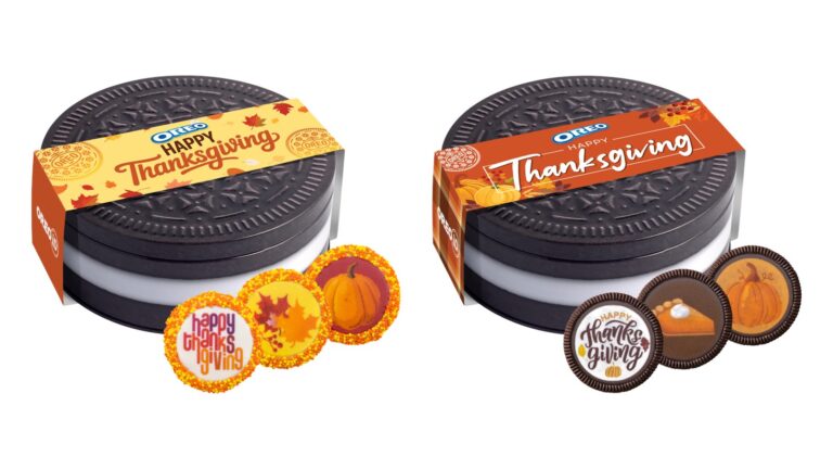Two Oreo-shaped Thanksgiving cookie tins, the fudge-dipped tin with a yellow band and sprinkle-rimmed cookies, the fudge-less tin with an orange band and pumpkin, pie and lettering cookies.